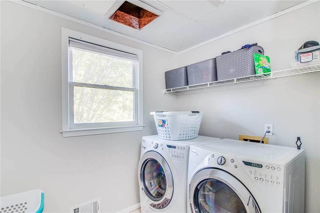 3925 Mark Lake Road Cumming, GA 30028 - Photo 20 of 59 a view of washer and dryer in a room