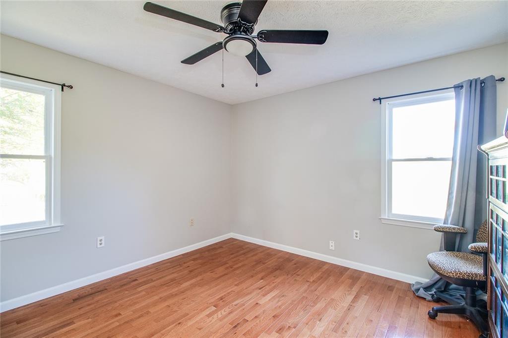 3925 Mark Lake Road Cumming, GA 30028 - Photo 28 of 59 a view of a room with wooden floor and windows
