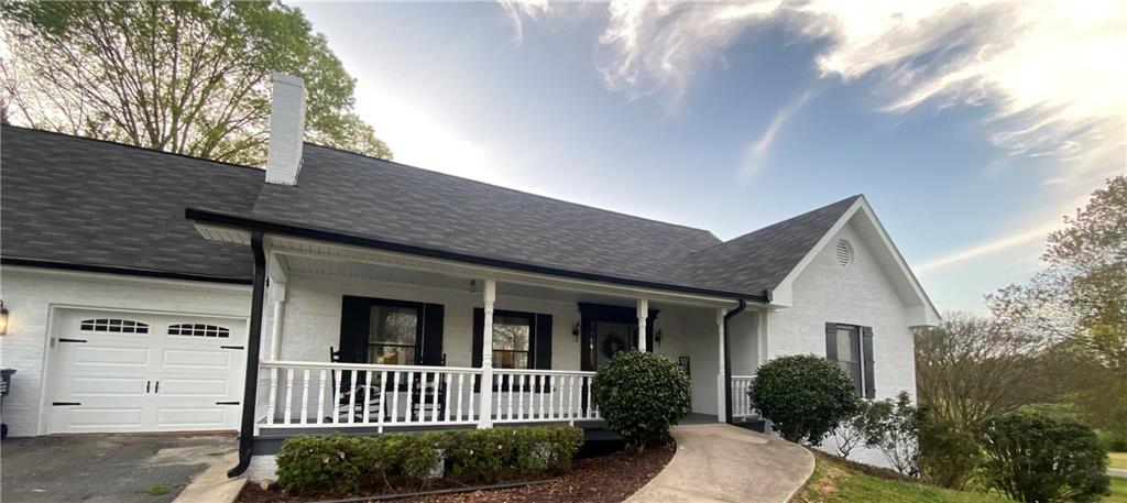3925 Mark Lake Road Cumming, GA 30028 - Photo 3 of 59 a view of a house with a yard