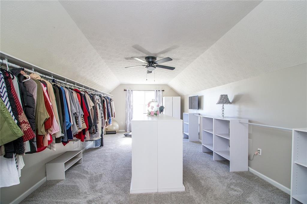 3925 Mark Lake Road Cumming, GA 30028 - Photo 36 of 59 a view of walk in closet with clothes and shoes