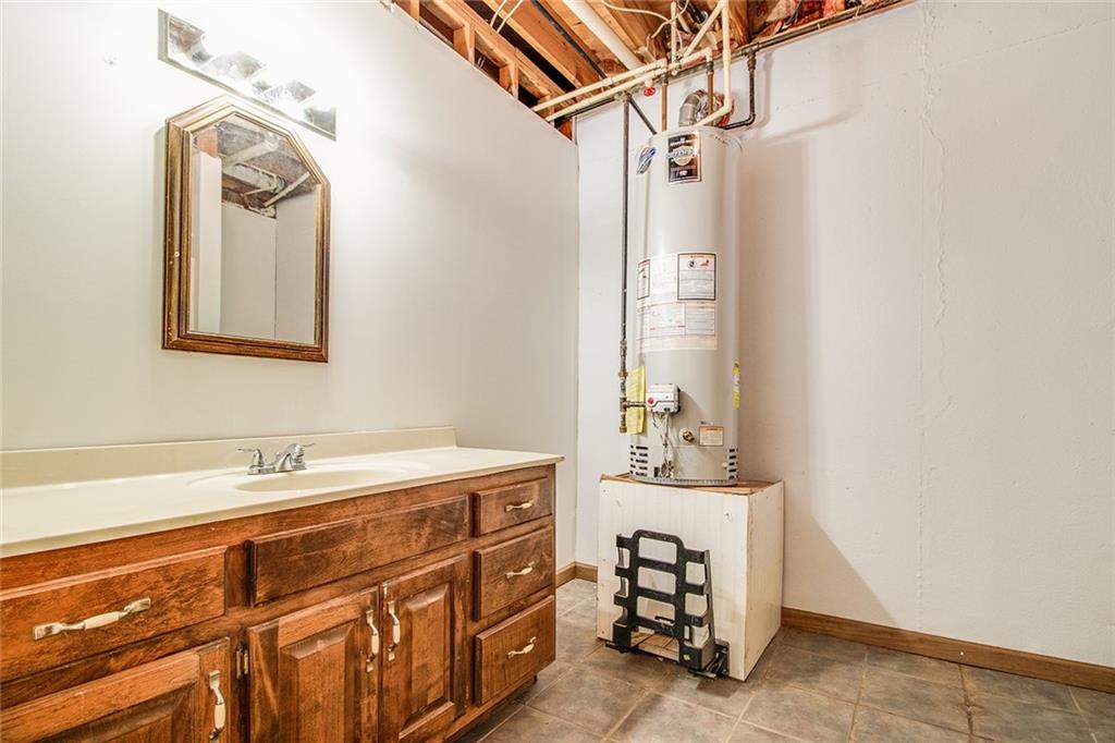 3925 Mark Lake Road Cumming, GA 30028 - Photo 43 of 59 a bathroom with a sink and a mirror