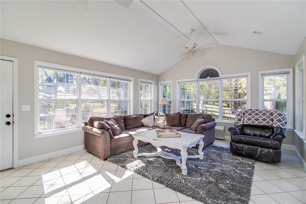 3925 Mark Lake Road Cumming, GA 30028 - Photo 46 of 59 a living room with furniture and a large window