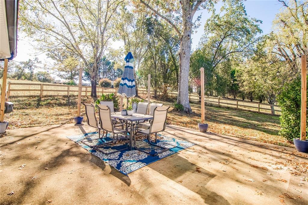 3925 Mark Lake Road Cumming, GA 30028 - Photo 49 of 59 a view of a backyard with sitting area