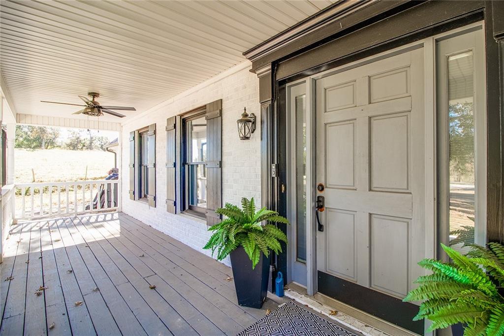 3925 Mark Lake Road Cumming, GA 30028 - Photo 5 of 59 a potted plant sitting in front of a house