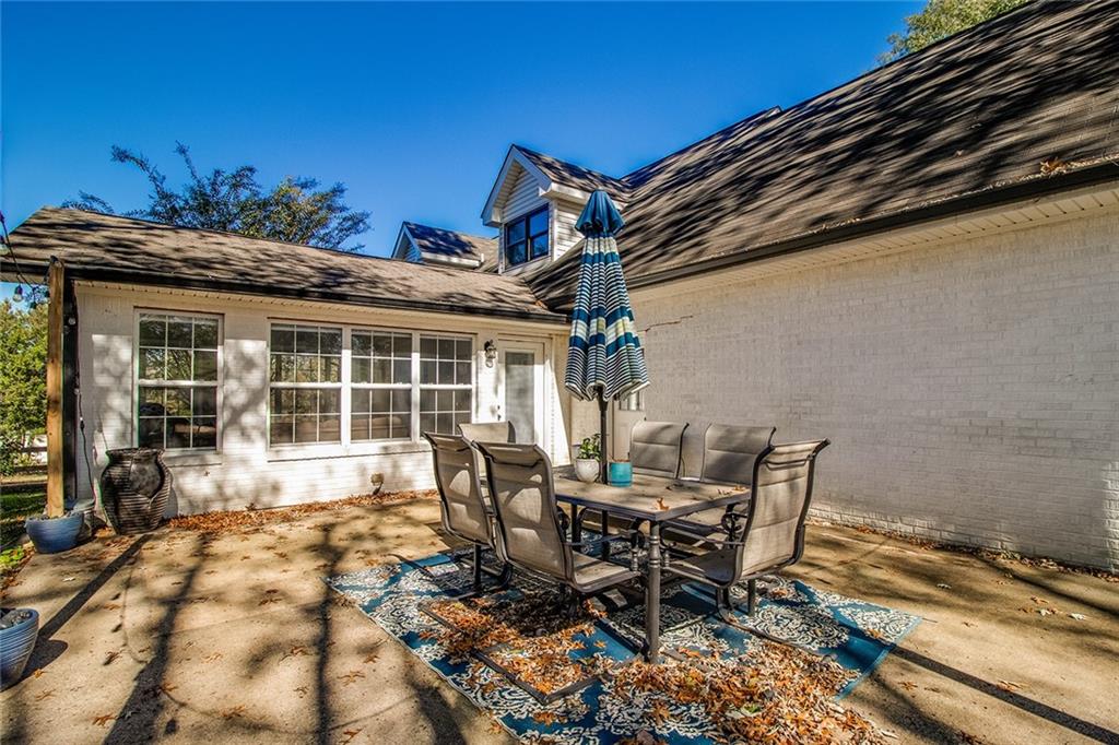 3925 Mark Lake Road Cumming, GA 30028 - Photo 51 of 59 a view of a dinning table and chairs in the patio