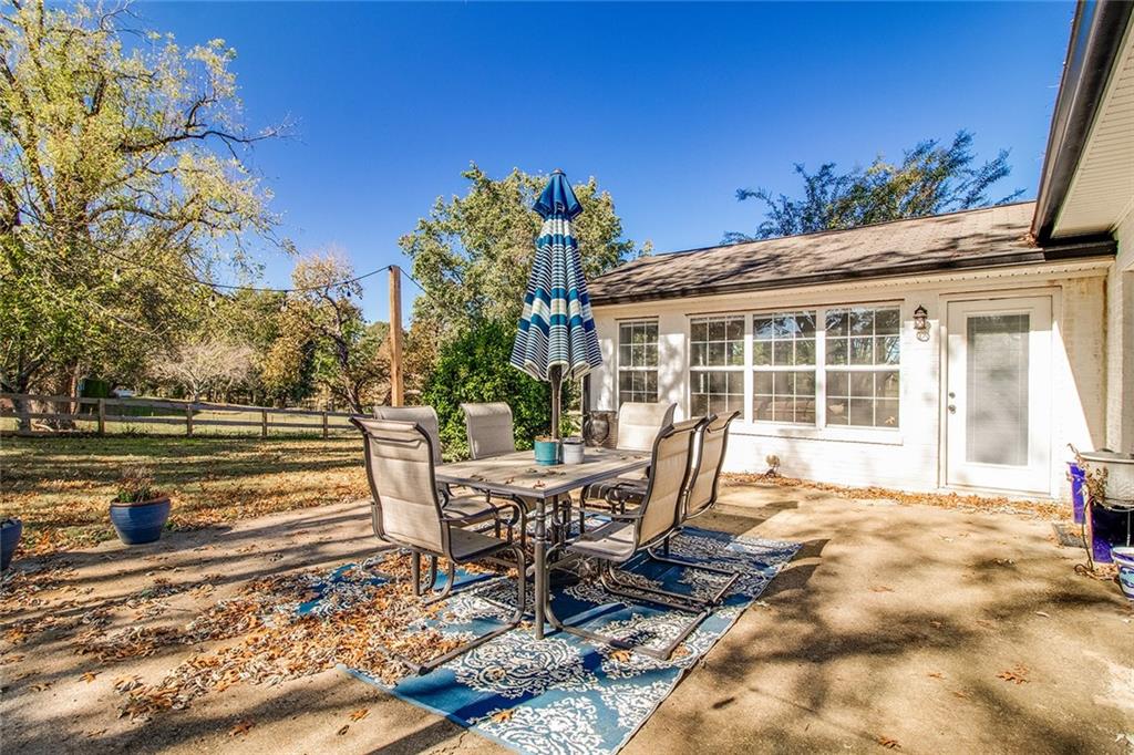 3925 Mark Lake Road Cumming, GA 30028 - Photo 52 of 59 a view of a house with backyard and sitting area
