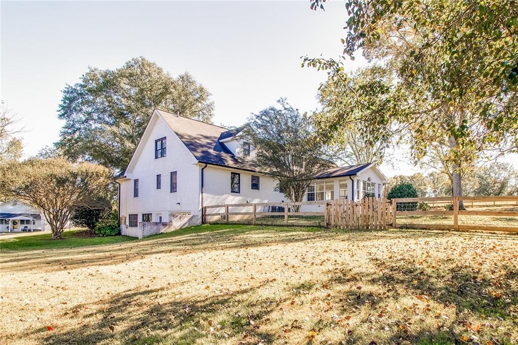 3925 Mark Lake Road Cumming, GA 30028 - Photo 59 of 59 a front view of a house with a yard