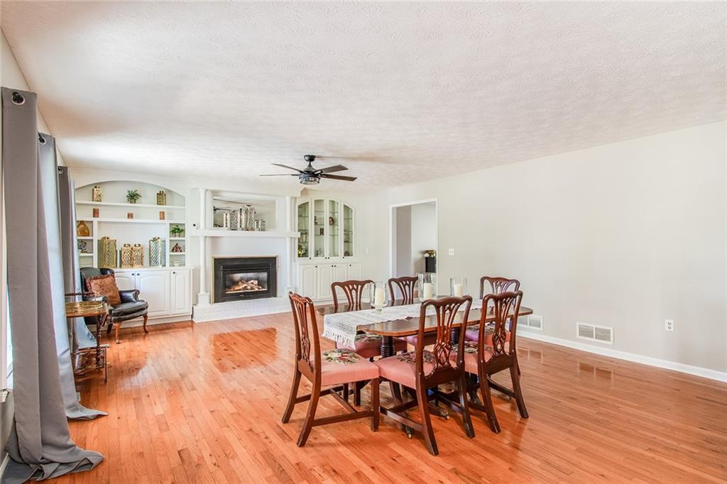 3925 Mark Lake Road Cumming, GA 30028 - Photo 9 of 59 a view of a livingroom with furniture and a fireplace