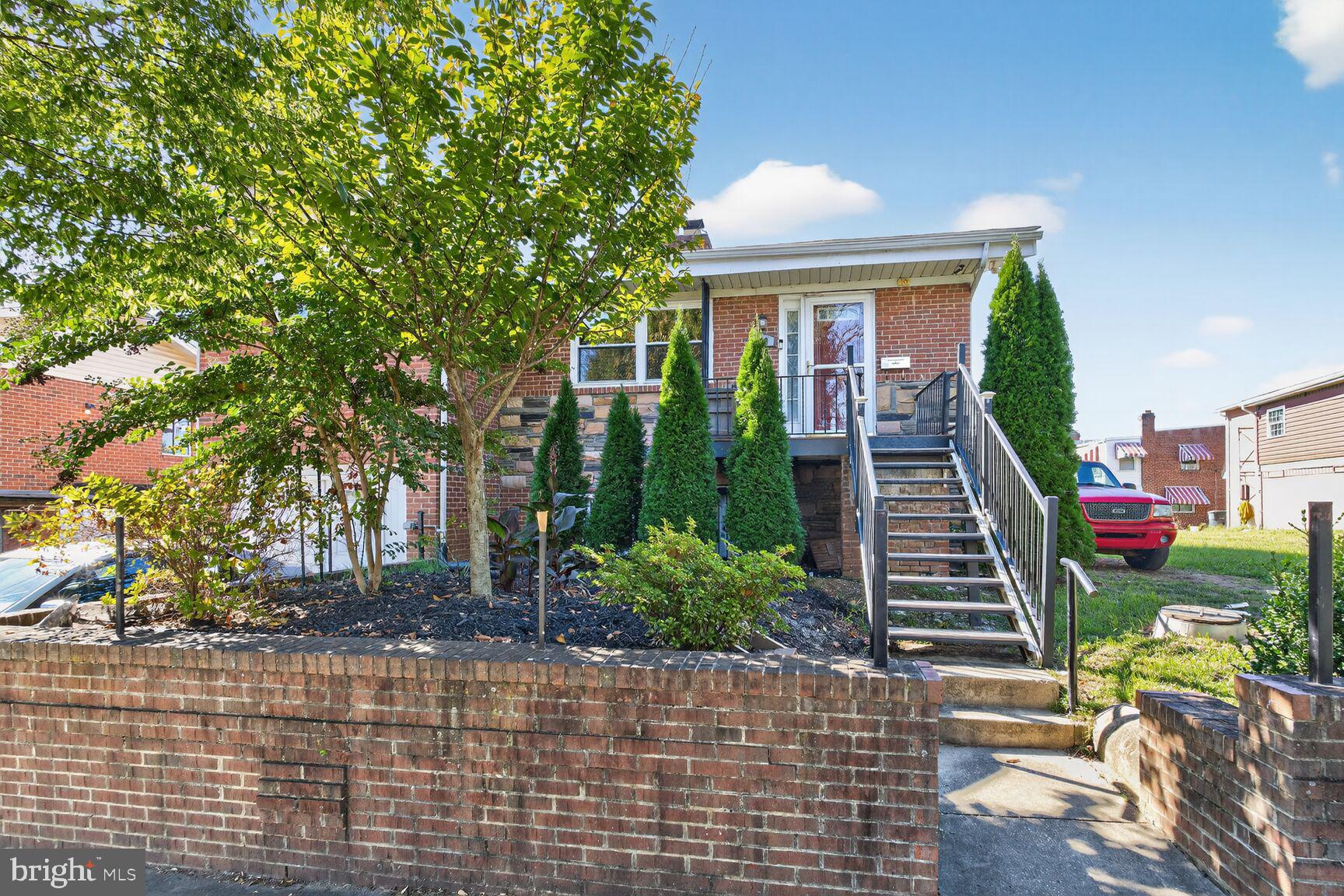 260 45th Street Northeast Washington, DC 20019 - Photo 1 of 19 Charming brick home with lush greenery.