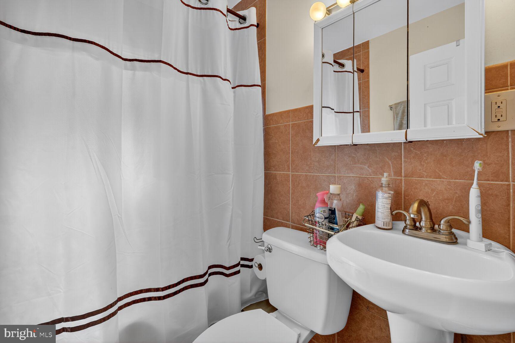 260 45th Street Northeast Washington, DC 20019 - Photo 12 of 19 Charming bathroom with warm tones.
