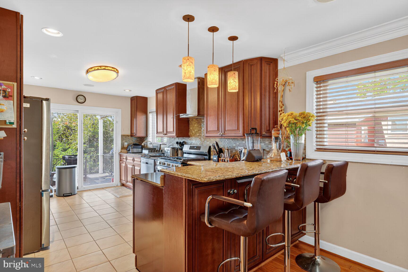 260 45th Street Northeast Washington, DC 20019 - Photo 5 of 19 Modern kitchen with warm wood tones.