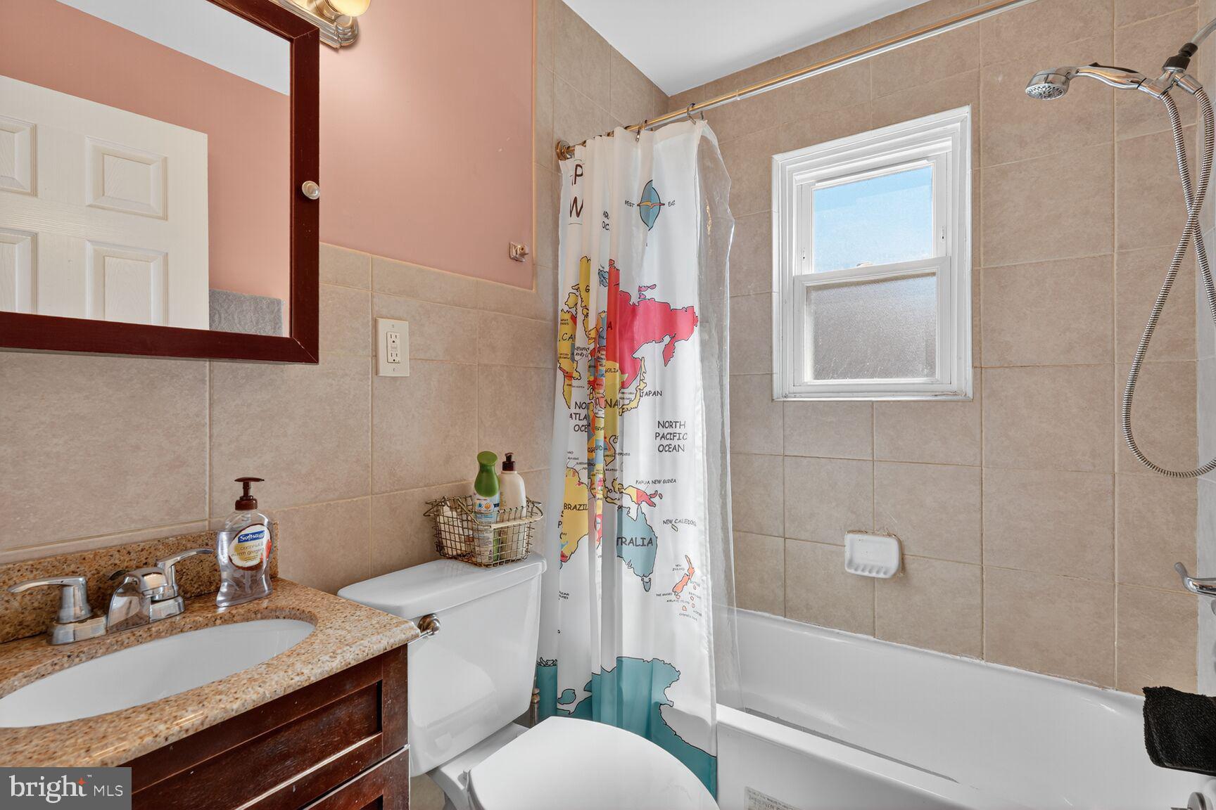 260 45th Street Northeast Washington, DC 20019 - Photo 10 of 19 Charming bath with world map decor.