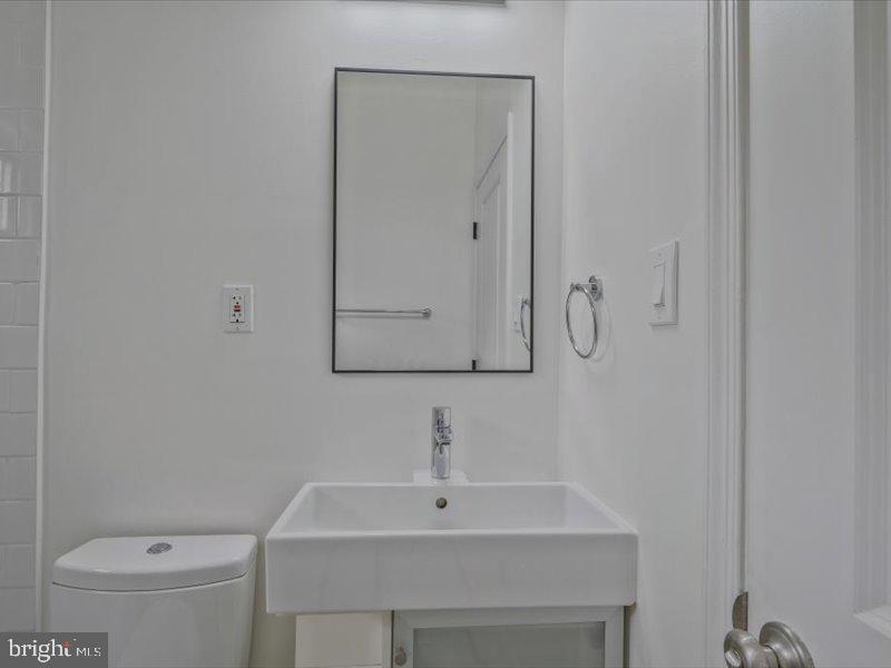 1200 D Street Northeast Washington, DC 20002 - Photo 34 of 47 Sleek and modern bathroom oasis.