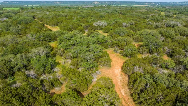 a view of a lake with a yard