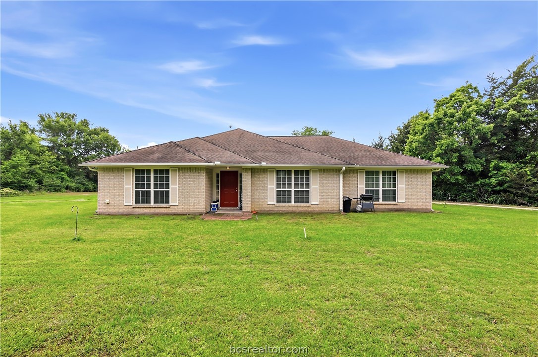 11901 Bundic Road North Zulch, TX 77872 - Photo 1 of 29 a front view of a house with a yard