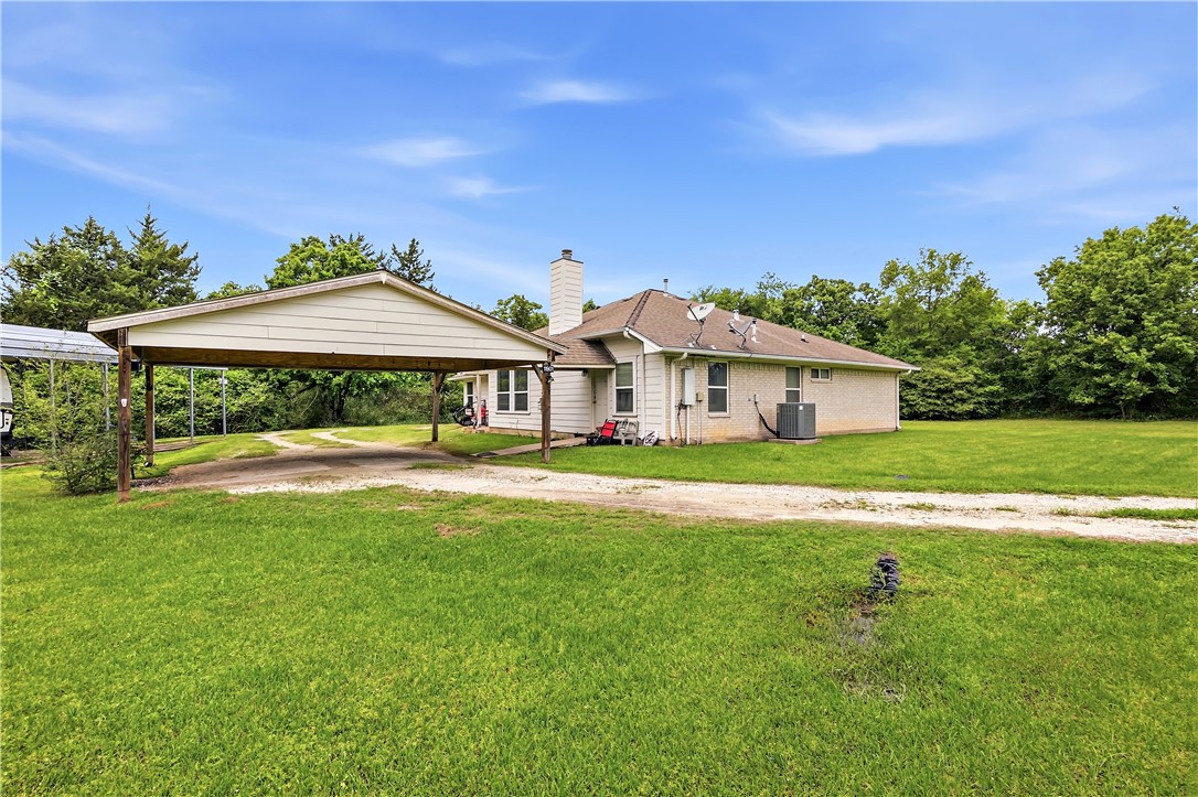 11901 Bundic Road North Zulch, TX 77872 - Photo 23 of 29 a front view of a house with garden