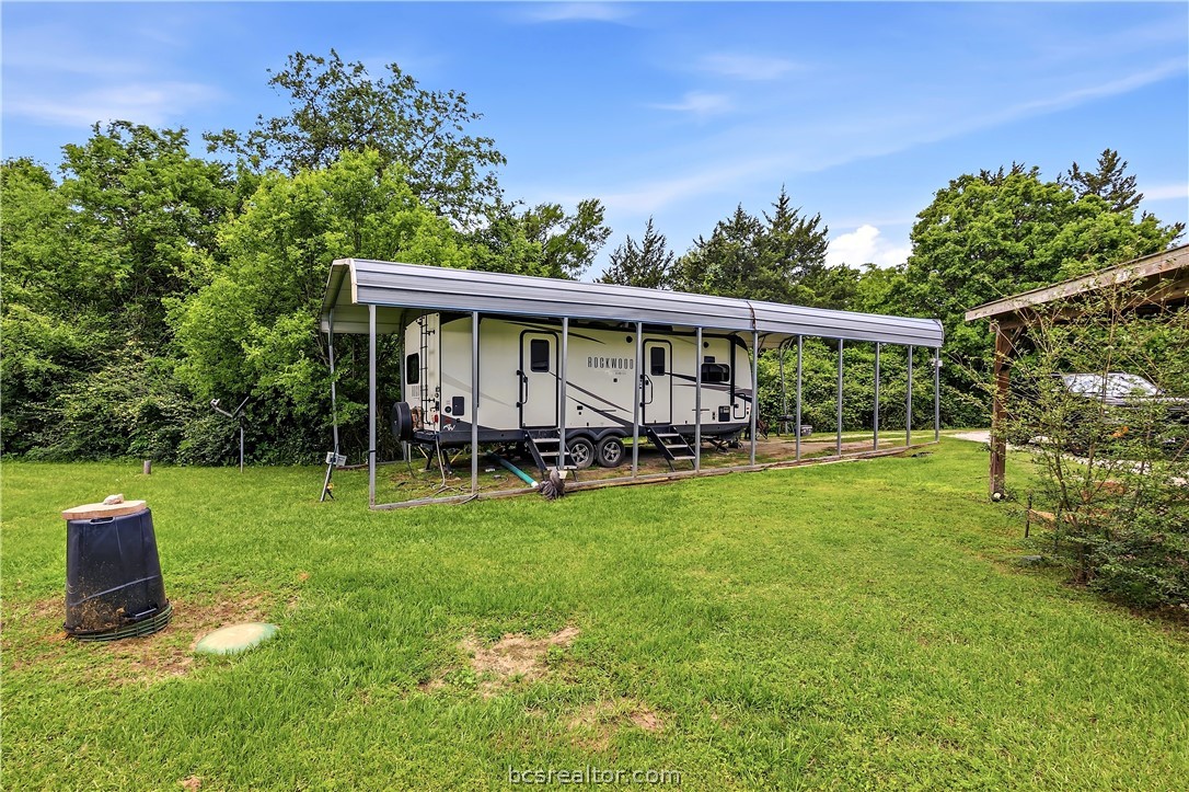 11901 Bundic Road North Zulch, TX 77872 - Photo 26 of 29 a view of a backyard with plants and garden