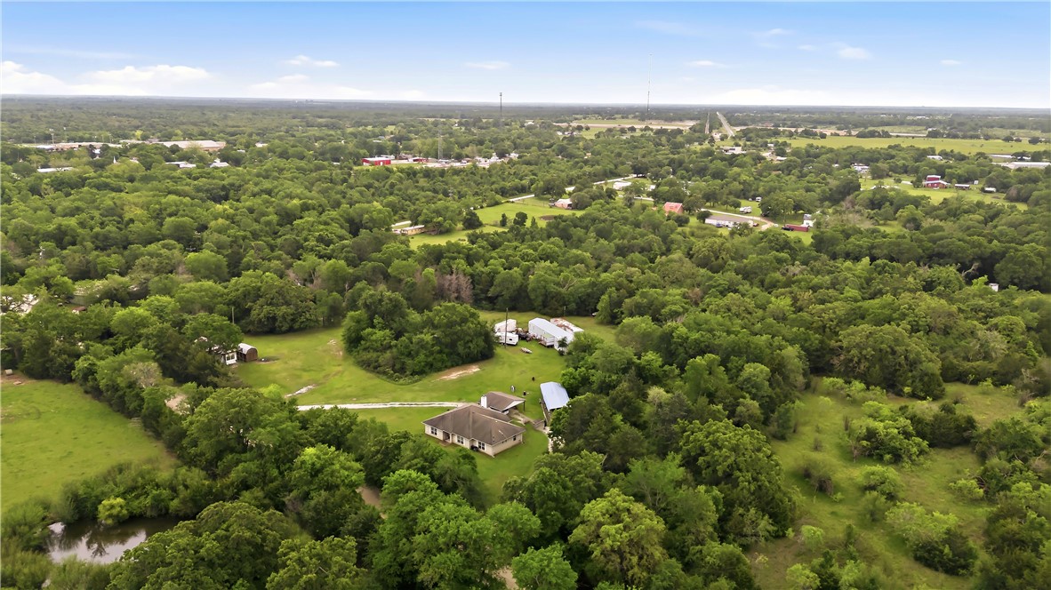 11901 Bundic Road North Zulch, TX 77872 - Photo 28 of 29 an aerial view of residential houses with outdoor space and trees