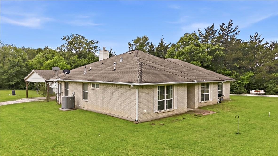 11901 Bundic Road North Zulch, TX 77872 - Photo 29 of 29 a view of a house with a yard