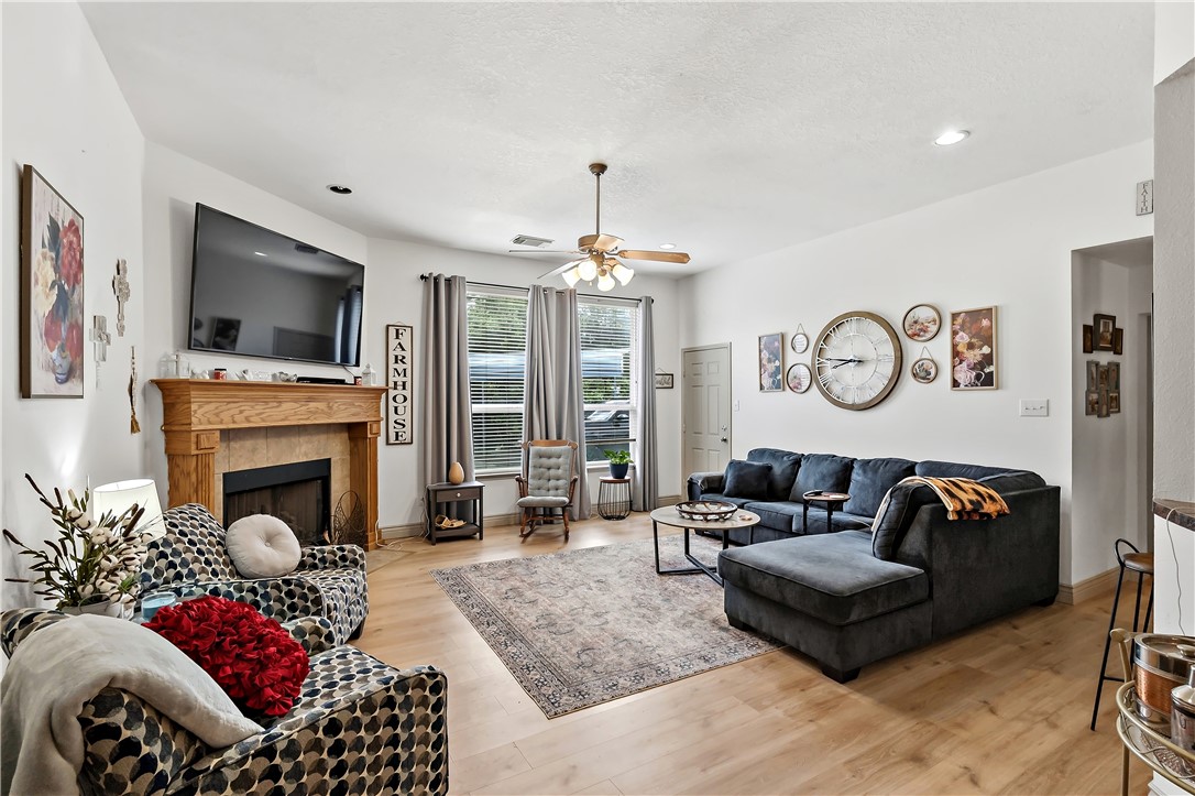 11901 Bundic Road North Zulch, TX 77872 - Photo 5 of 29 a living room with furniture or chandelier and a fireplace