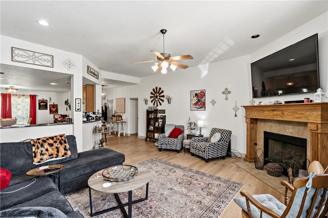 11901 Bundic Road North Zulch, TX 77872 - Photo 8 of 29 a living room with furniture a flat screen tv and a fireplace