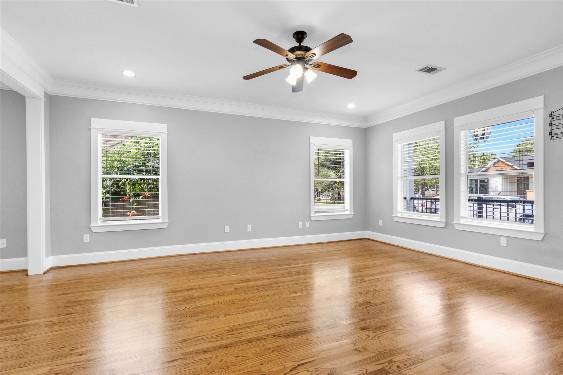 304 Vincent Street Houston, TX 77009 - Photo 6 of 36 a view of an empty room with wooden floor and a window