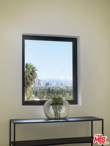 a room with a window and outdoor view