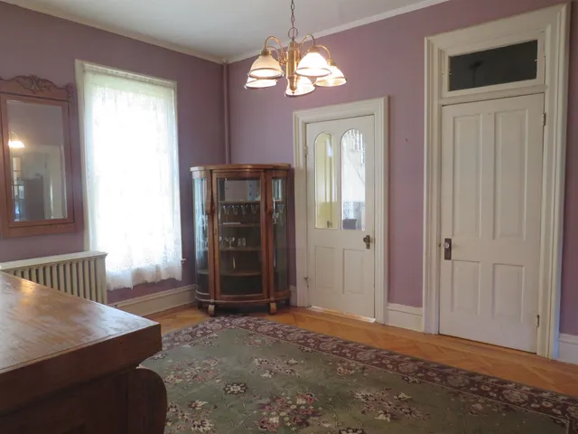 a view of a hallway with windows