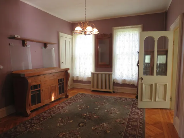 a view of a livingroom with furniture and a window