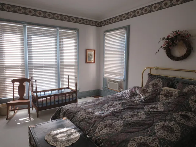 a view of a room with furniture and window