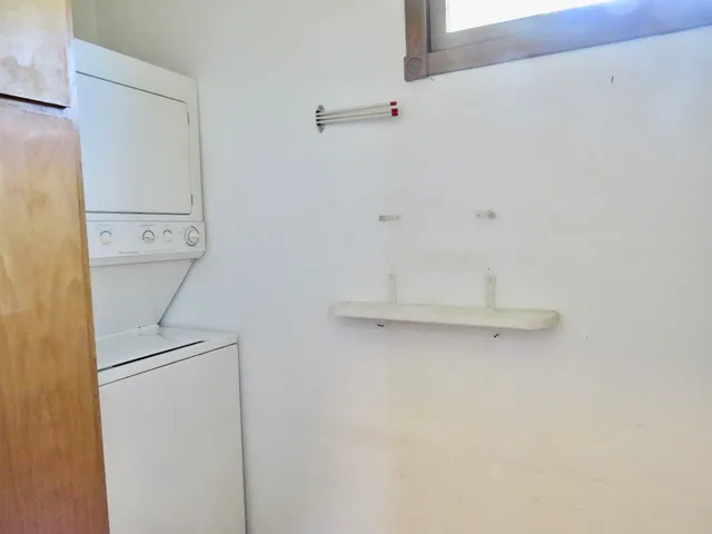 a bathroom with a toilet sink and shower