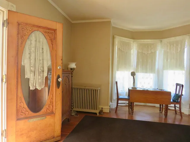 a view of a livingroom with furniture and staircase