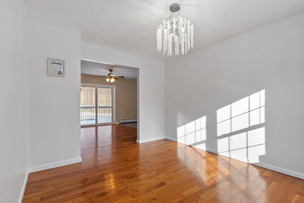 210 Bean Porridge Hill Road Westminster, MA 01473 - Photo 12 of 39 wooden floor in an empty room with a window