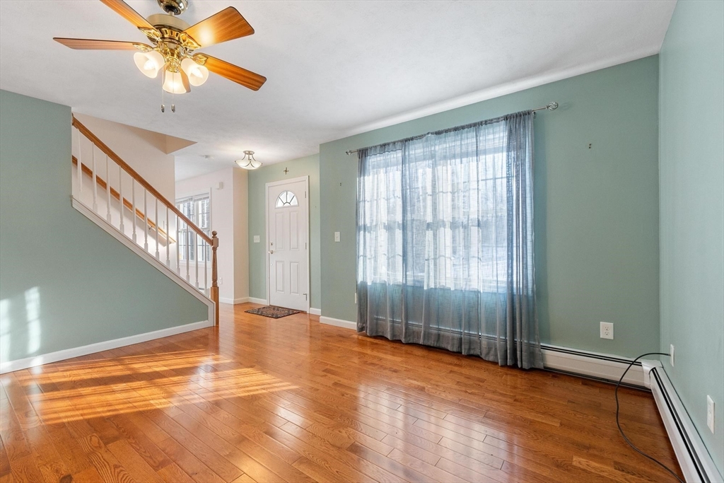 210 Bean Porridge Hill Road Westminster, MA 01473 - Photo 15 of 39 a view of an empty room with window and chandelier fan
