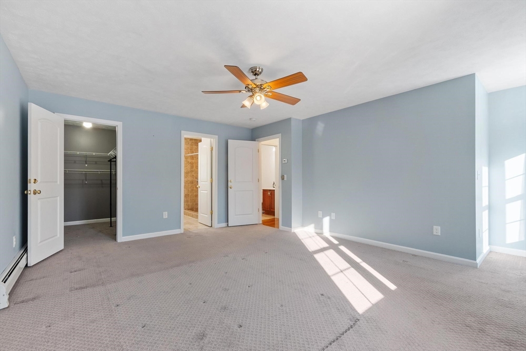 210 Bean Porridge Hill Road Westminster, MA 01473 - Photo 23 of 39 a view of a livingroom with a ceiling fan and window