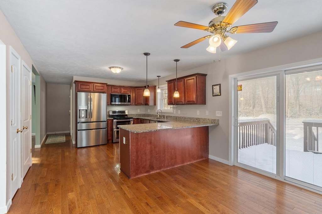 210 Bean Porridge Hill Road Westminster, MA 01473 - Photo 6 of 39 a kitchen with stainless steel appliances granite countertop a refrigerator a oven a sink and dishwasher with wooden floor