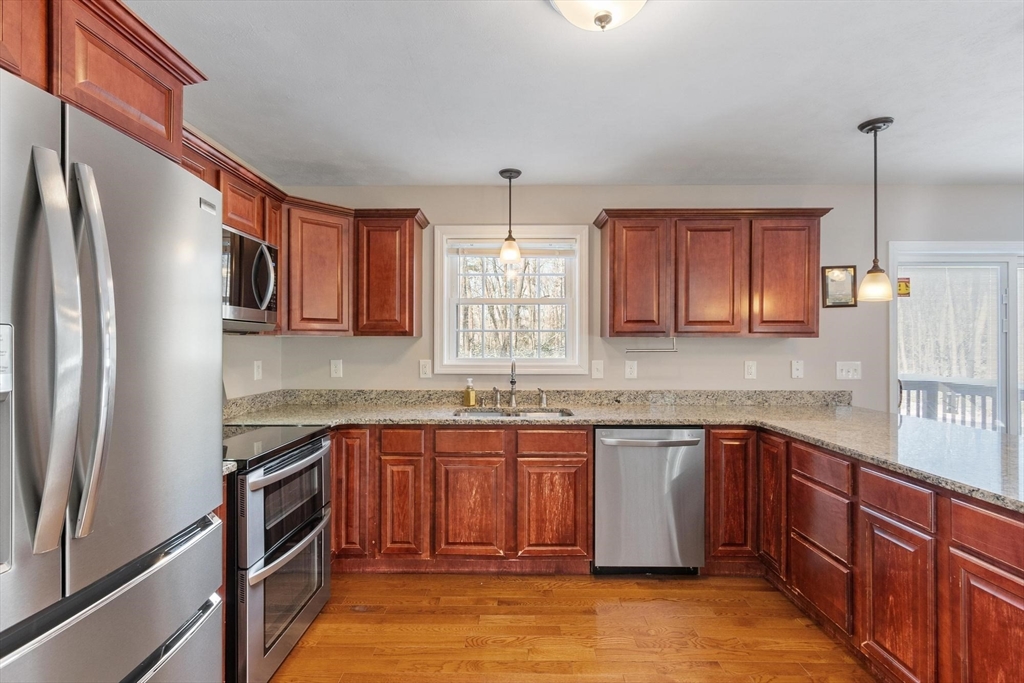 210 Bean Porridge Hill Road Westminster, MA 01473 - Photo 7 of 39 a kitchen with stainless steel appliances granite countertop a sink stove and refrigerator