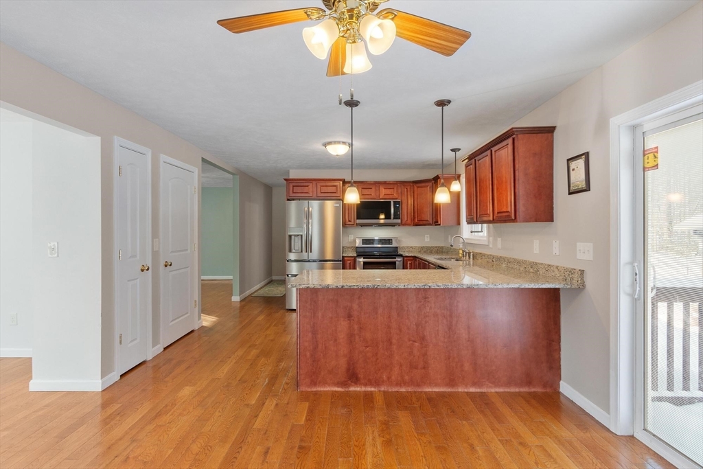 210 Bean Porridge Hill Road Westminster, MA 01473 - Photo 9 of 39 a large kitchen with lots of counter space and wooden floor