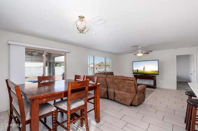 a dining room with furniture and window