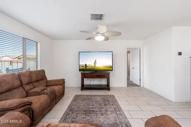 a living room with furniture and a rug