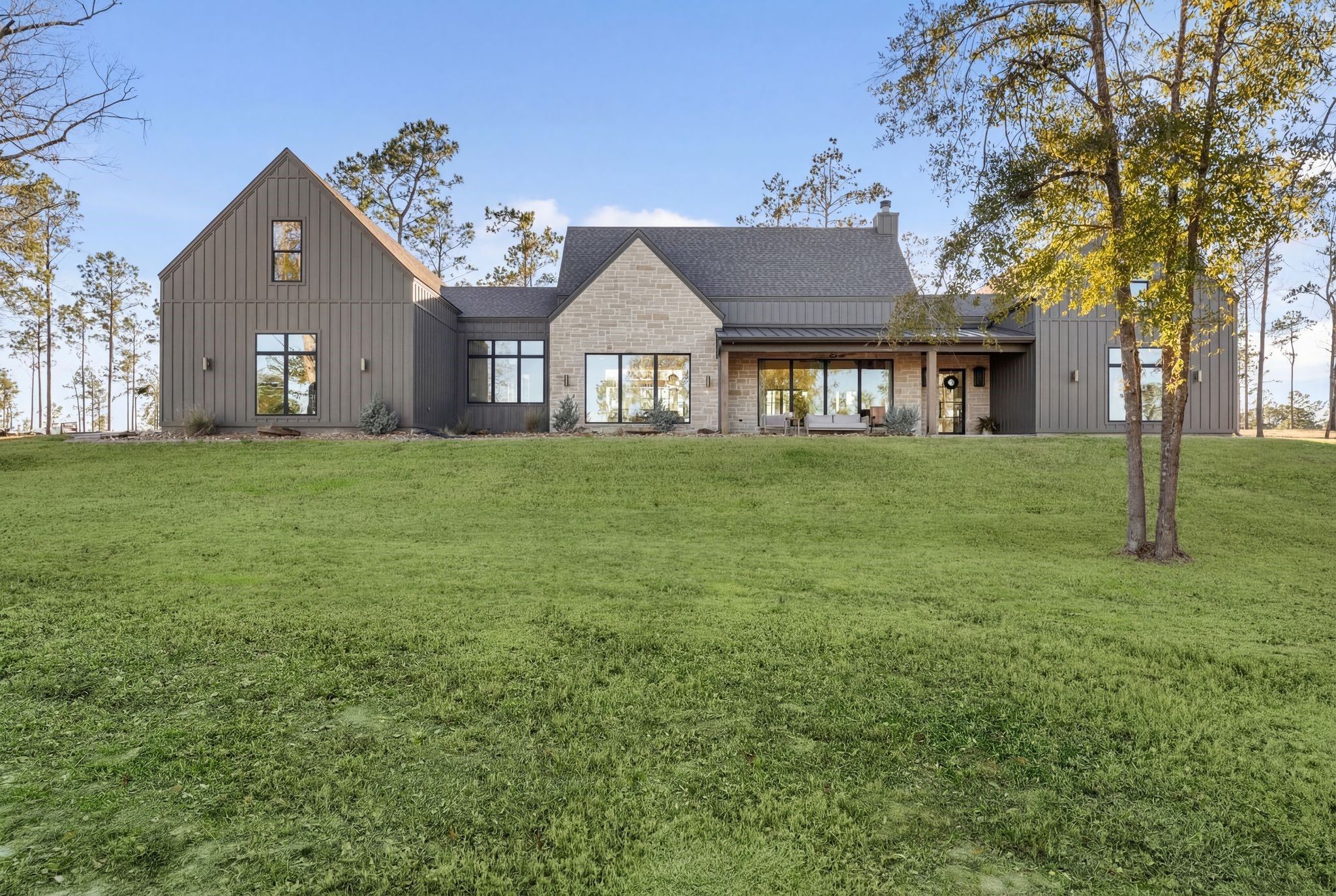 308 Western Road Livingston, TX 77351 - Photo 13 of 49 a large house with a big yard and large trees