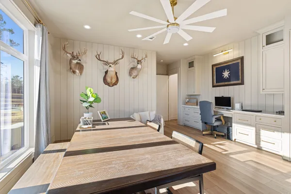 a very nice looking dining room with a table and chairs
