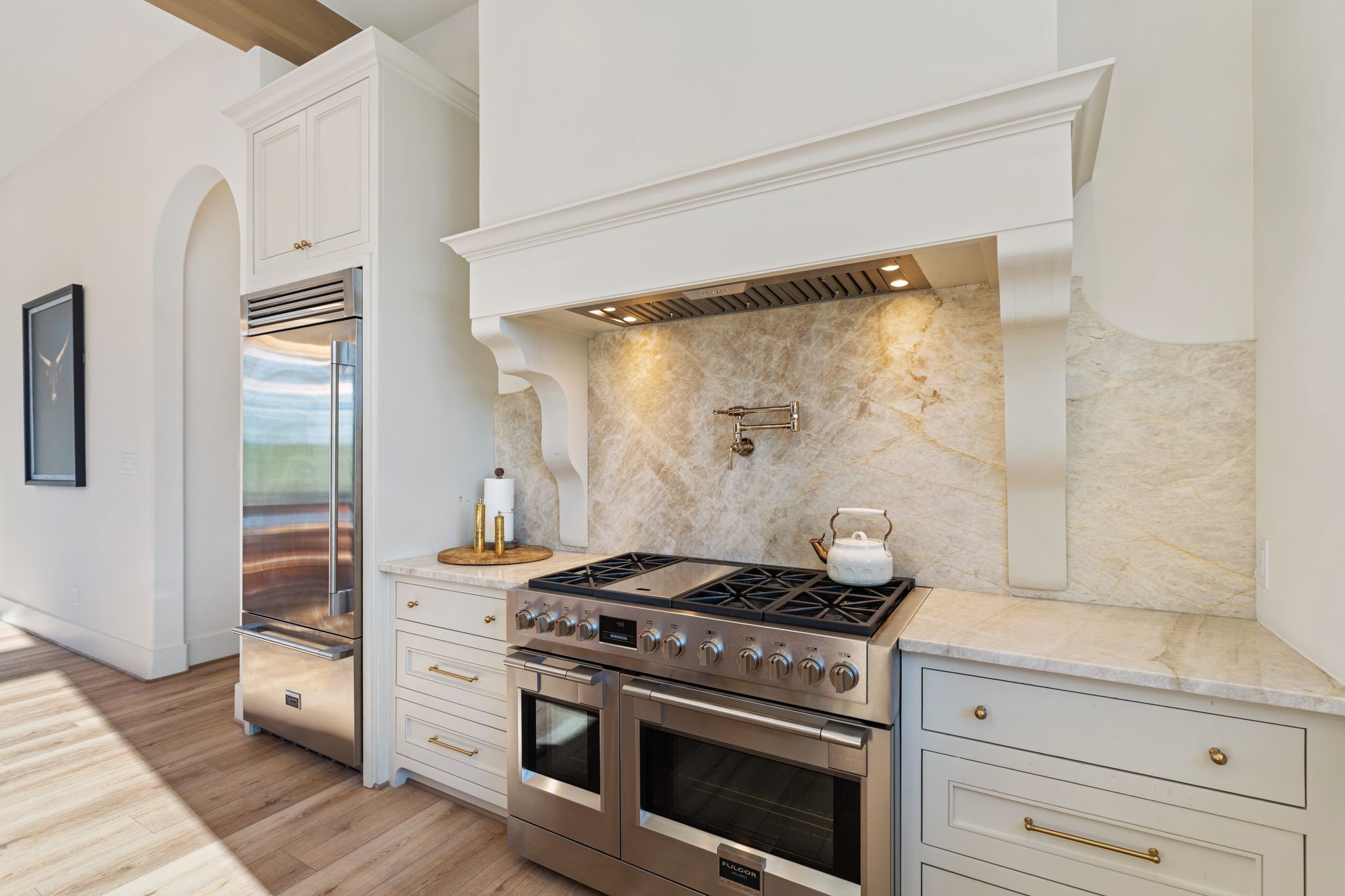 308 Western Road Livingston, TX 77351 - Photo 22 of 49 a kitchen with a stove and a wooden floor