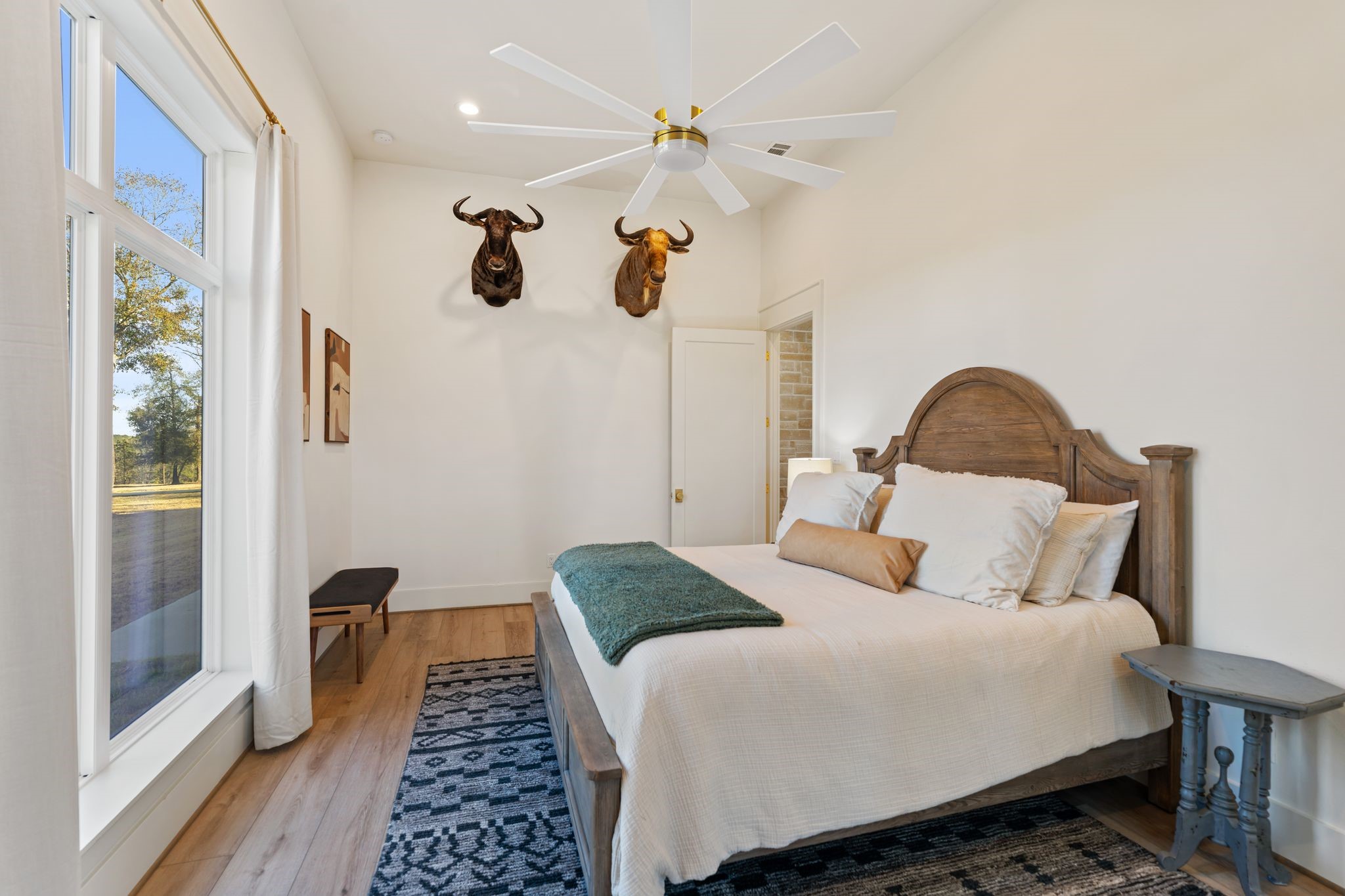 308 Western Road Livingston, TX 77351 - Photo 33 of 49 a bedroom with a bed and wooden floor