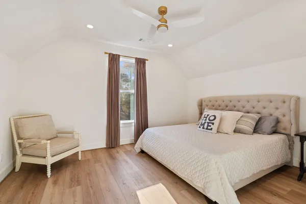 a bedroom with a bed and a couch