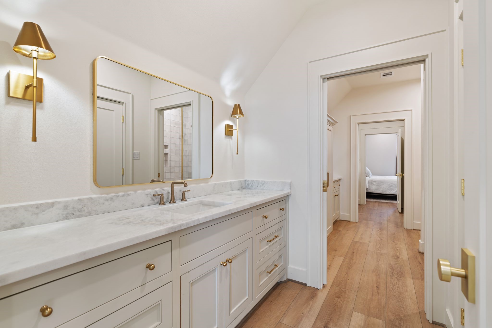 308 Western Road Livingston, TX 77351 - Photo 36 of 49 a spacious bathroom with a granite countertop sink mirror and vanity