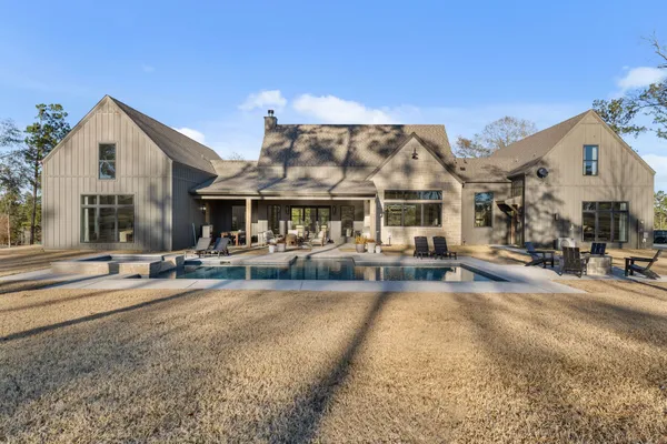 a view of a house with sitting area and furniture