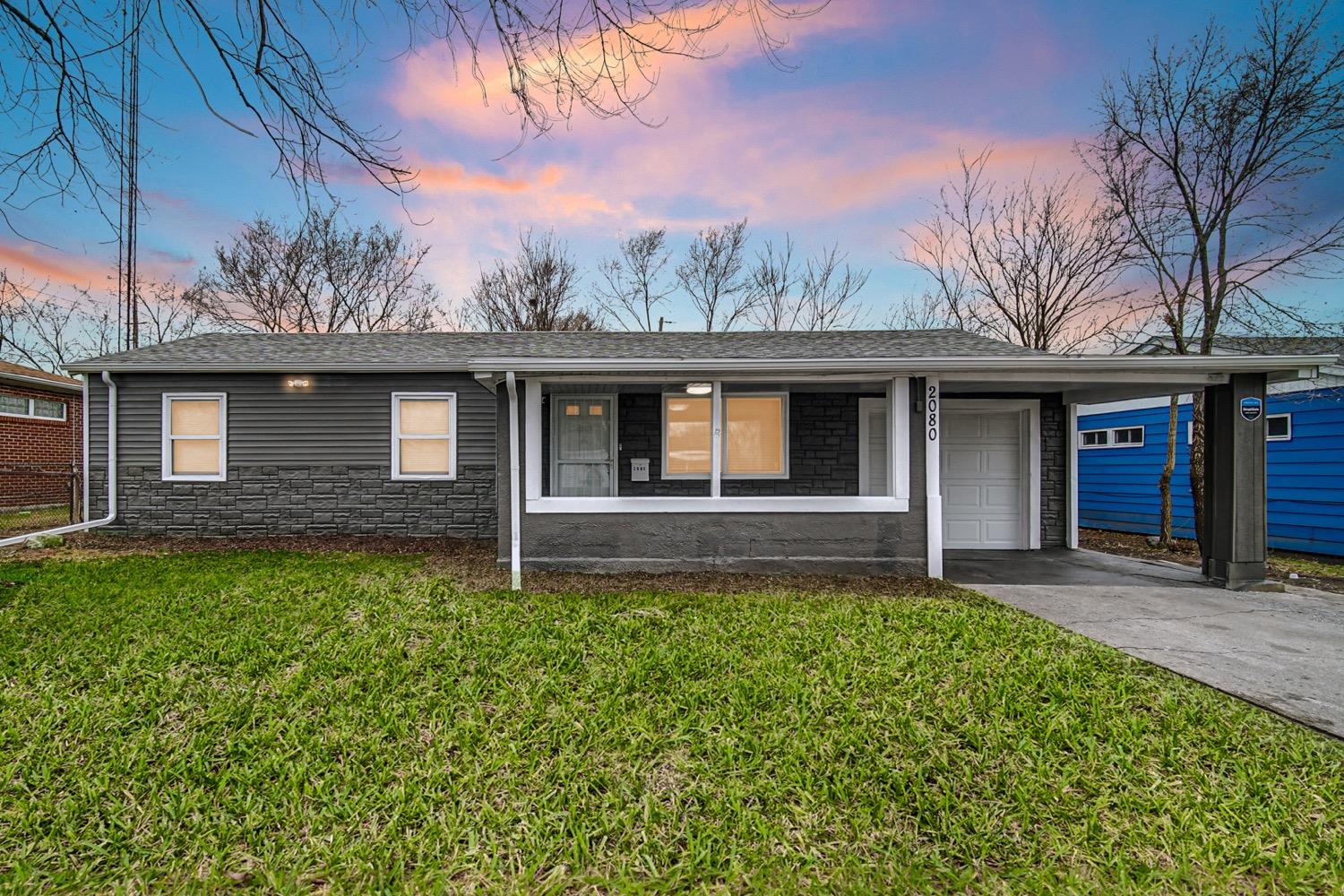 a front view of a house with garden