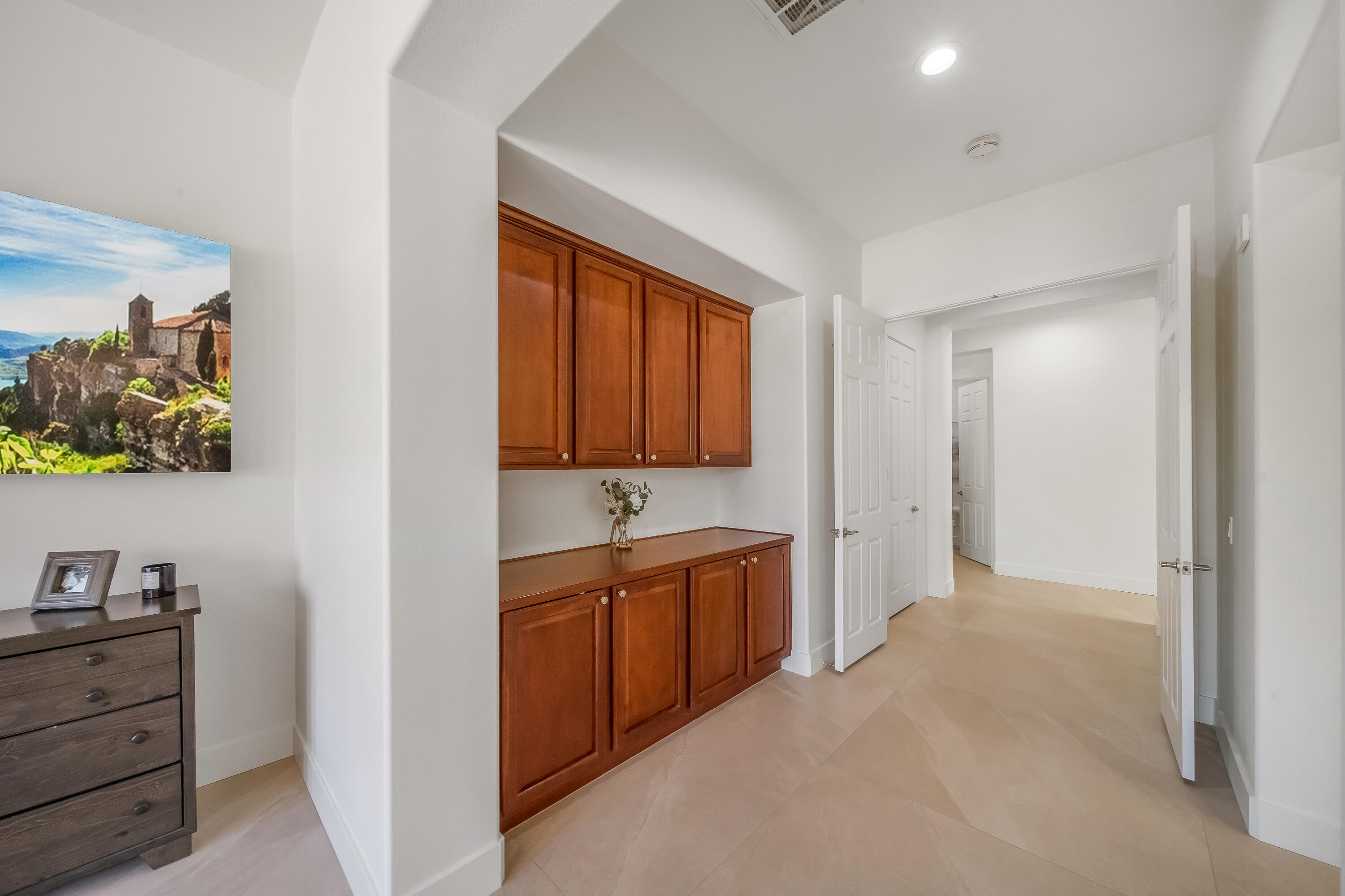 80262 Amazon Avenue Indio, CA 92201 - Photo 48 of 69 a view of a kitchen with cabinets flat screen tv and outdoor space
