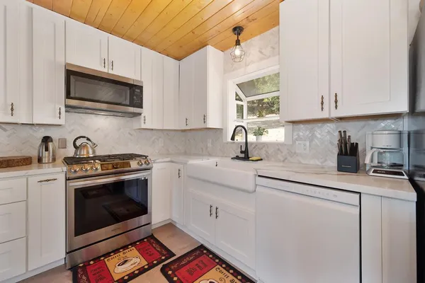 a bedroom with a large bed and a window